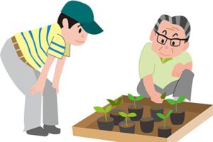 農業を教える高齢農家と教えてもらっている若者農家